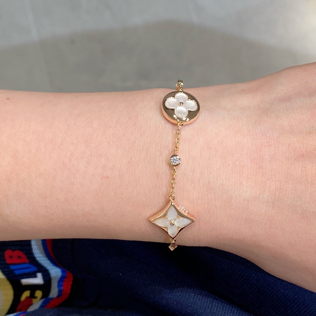 [Elara jewelsry ]STAR AND SUN 4 MOTIF WHITE MOP PINK GOLD BRACELET