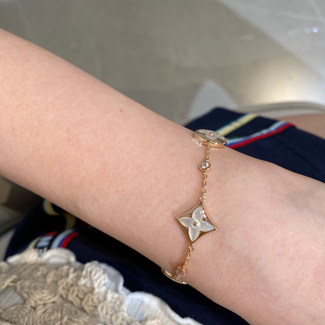 [Elara jewelsry ]STAR AND SUN 4 MOTIF WHITE MOP PINK GOLD BRACELET